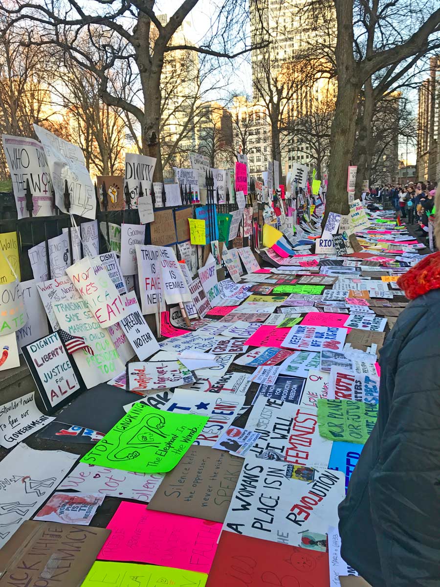 After the Pussy Hat March in Boston Massachusetts -everyone's  signs on the fence and sidewalk