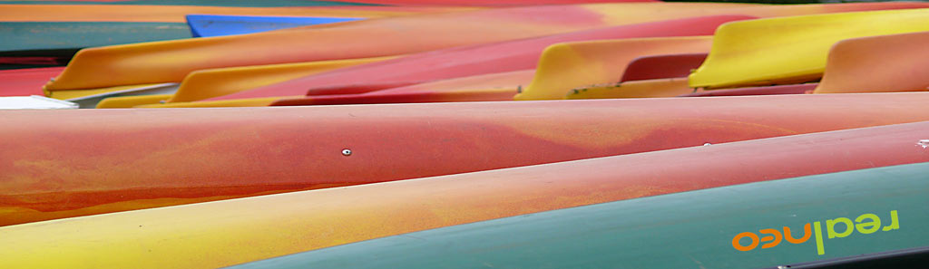 Plastic rental canoes are very colorful